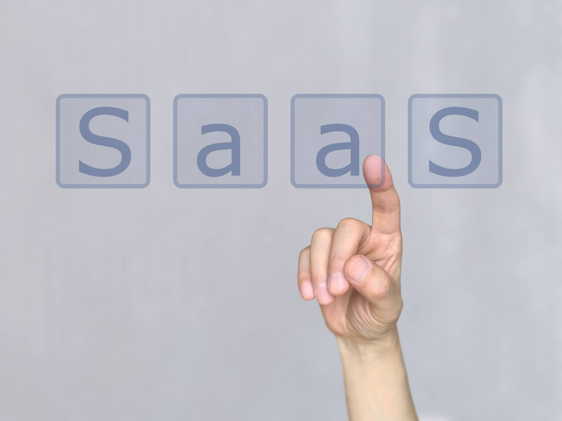 SaaSの概念を指す手のイメージ